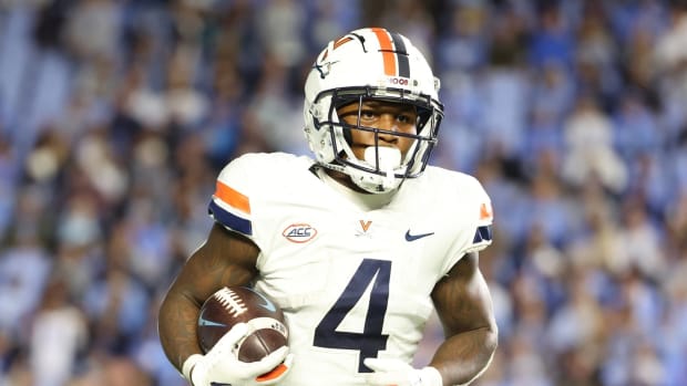 Malik Washington warms up before the Virginia football game against North Carolina at Kenan Memorial Stadium in Chapel Hill.